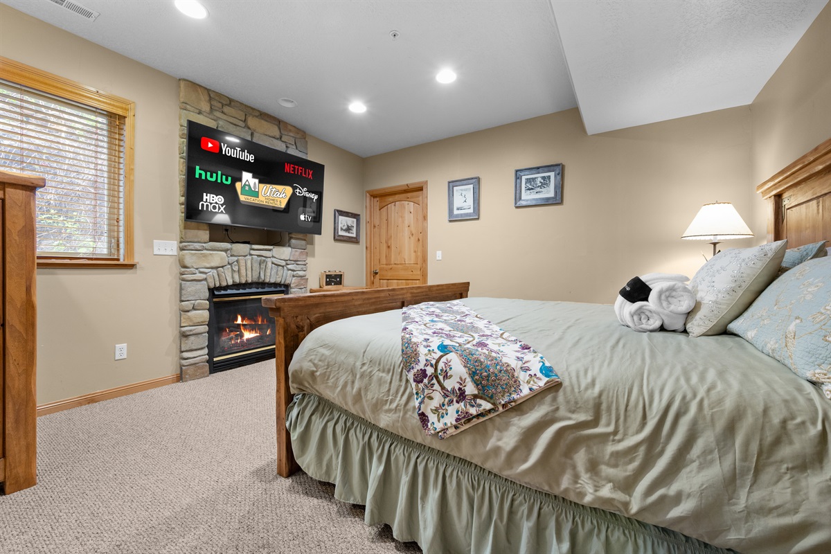 Cozy up by the fire in a private bedroom retreat.
