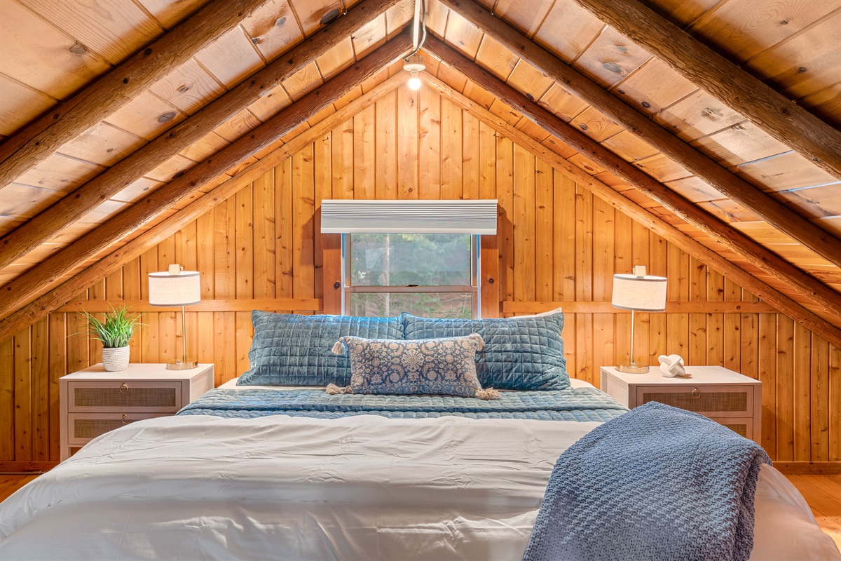 Enjoy sleeping in the loft with angled ceilings in your private king bed. An oversized chair with twin pullout also sleeps one. 