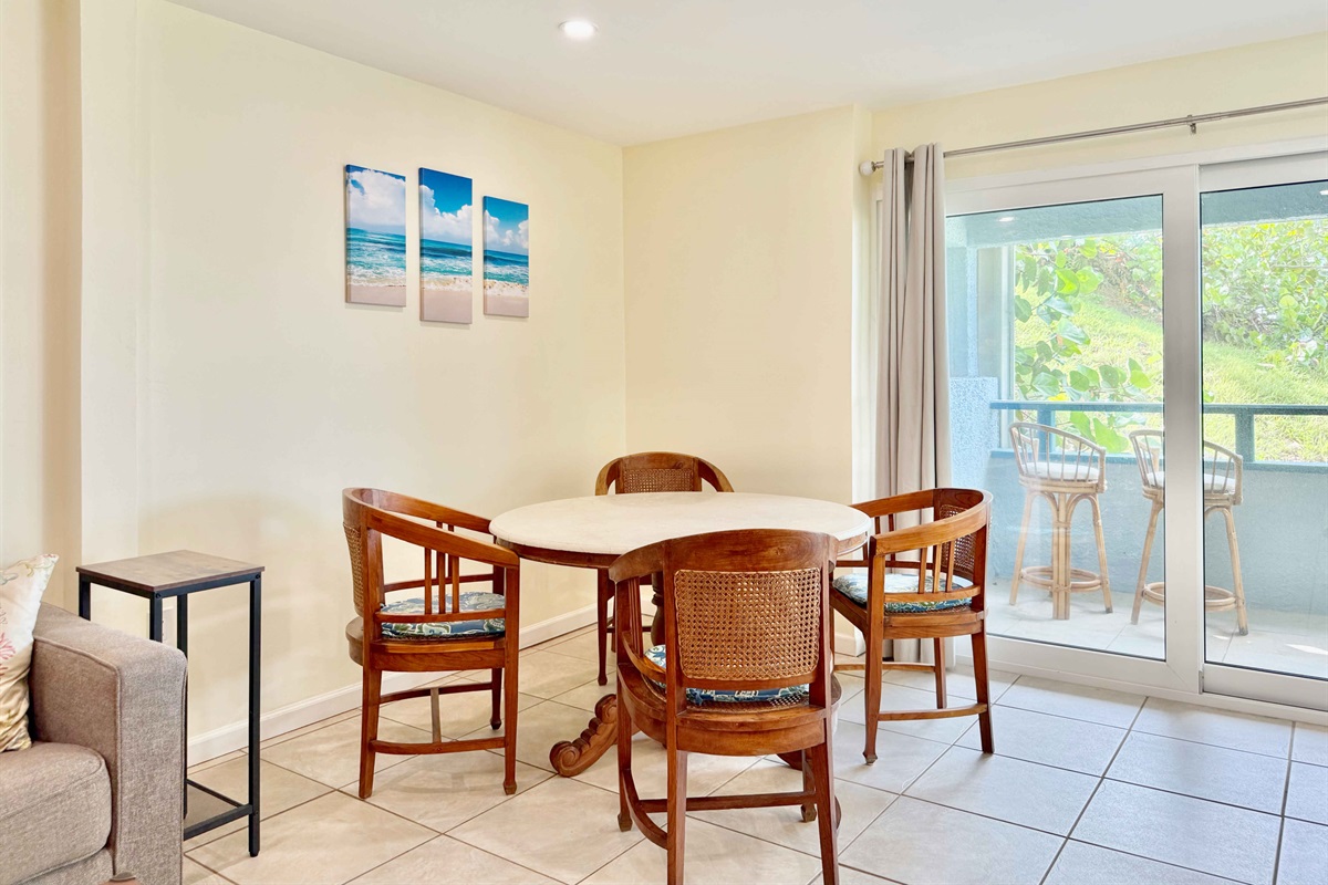 Dining area with seating for 4 and there are two more spots at the island