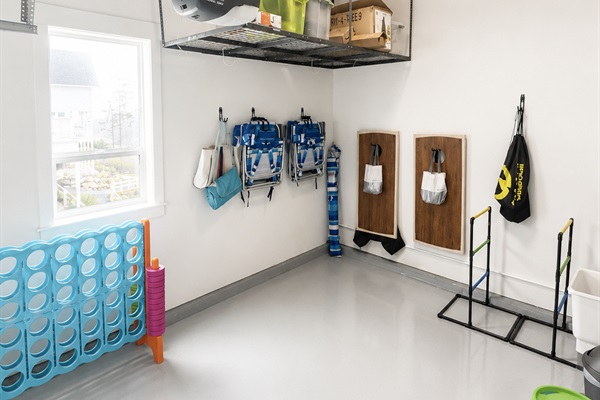 Garage stocked with beach gear and fun outdoor games for guests to enjoy during their stay.