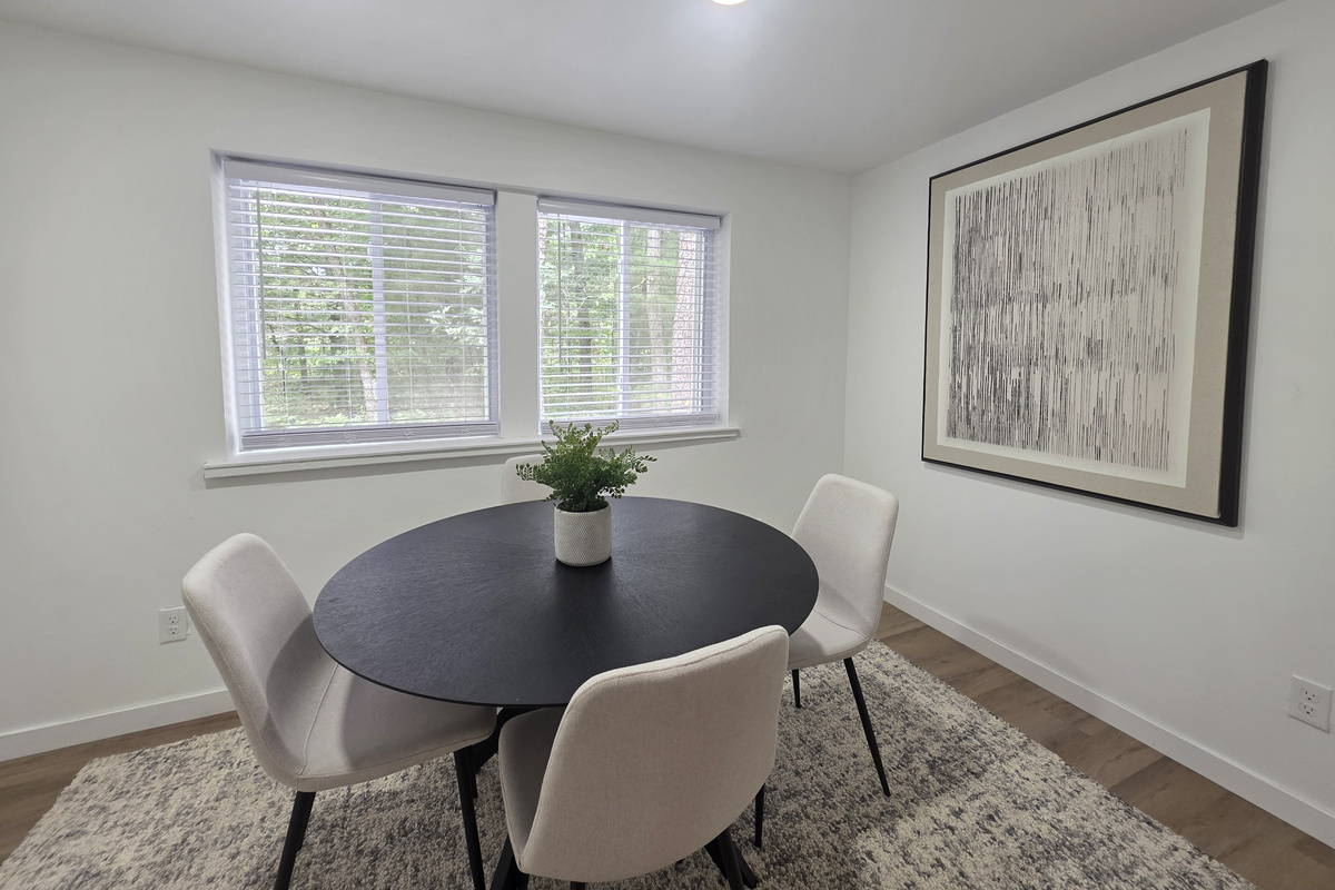 Dining room with table and 4 chairs.