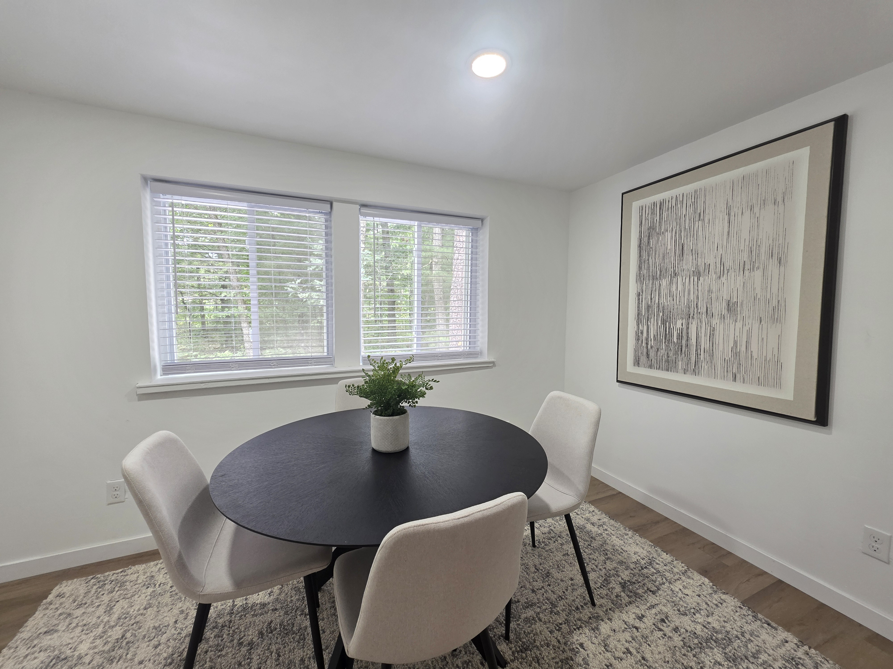 Dining room with table and 4 chairs.