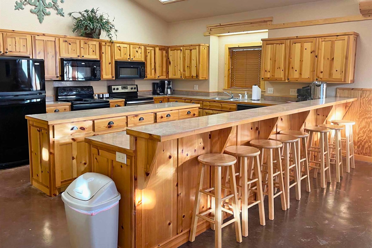 Community center kitchen with bar seating.