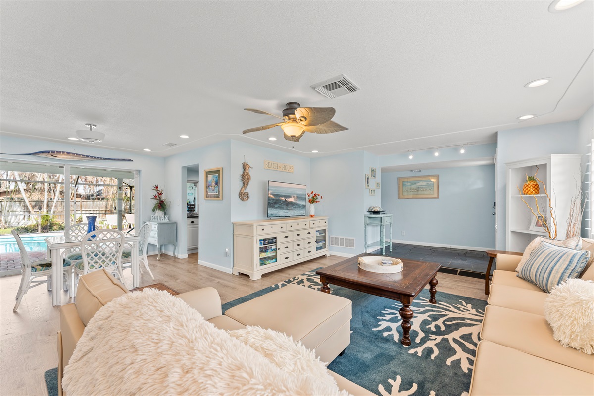 Living Room with large sliding glass door to the pool area