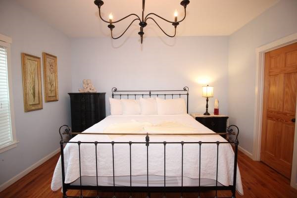 Wake up refreshed in the master suite, featuring a luxury king bed for the ultimate comfort.