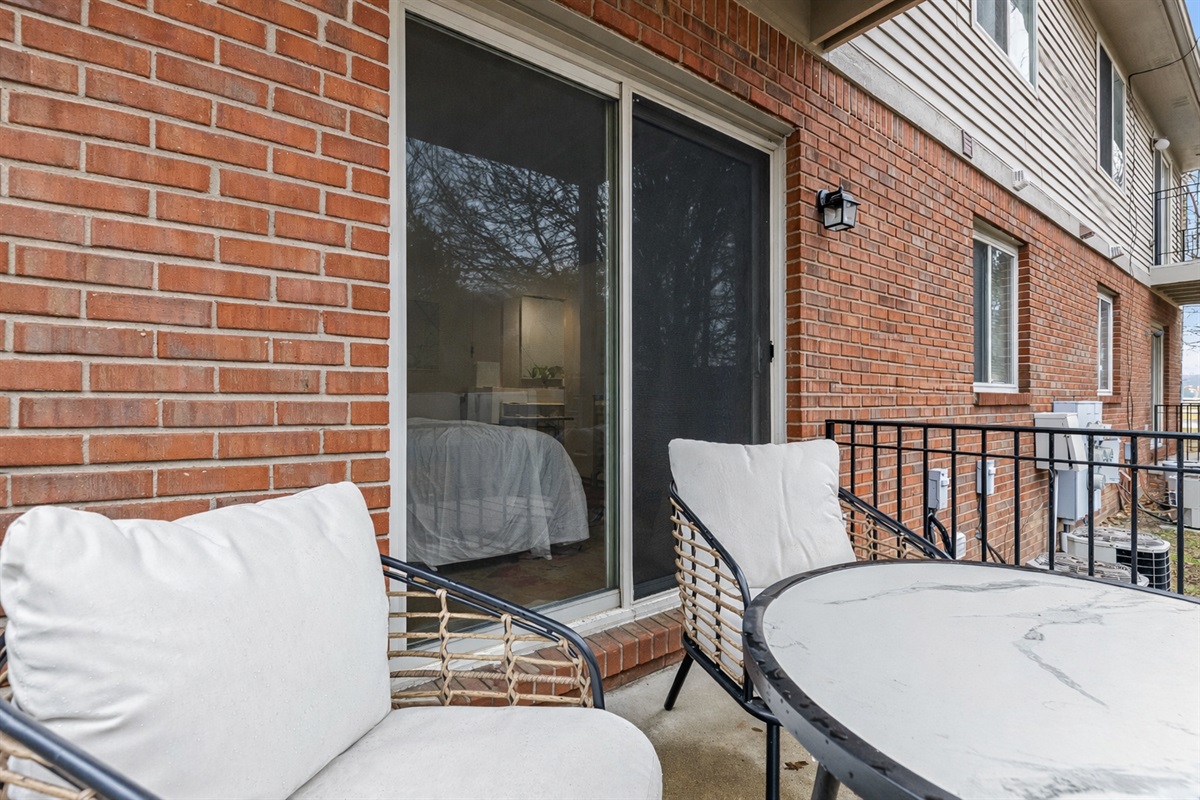 Private patio with comfortable seating, perfect for enjoying a quiet morning coffee or unwinding in the evening.