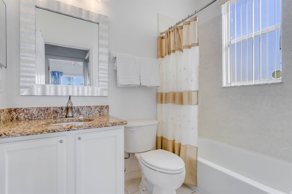 The shared bath on the first floor is also a full bath with a tub and shower combo.