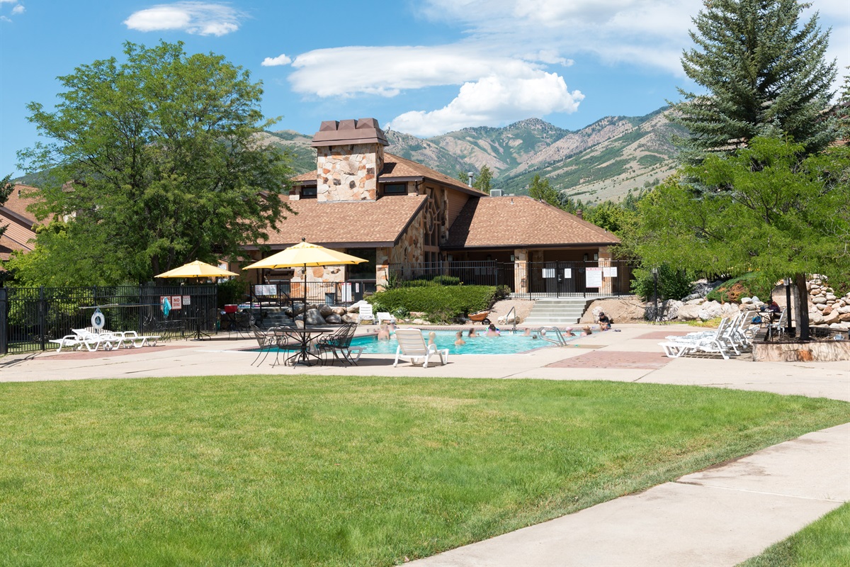 Enjoy sunny days at the community pool with beautiful alpine surroundings.