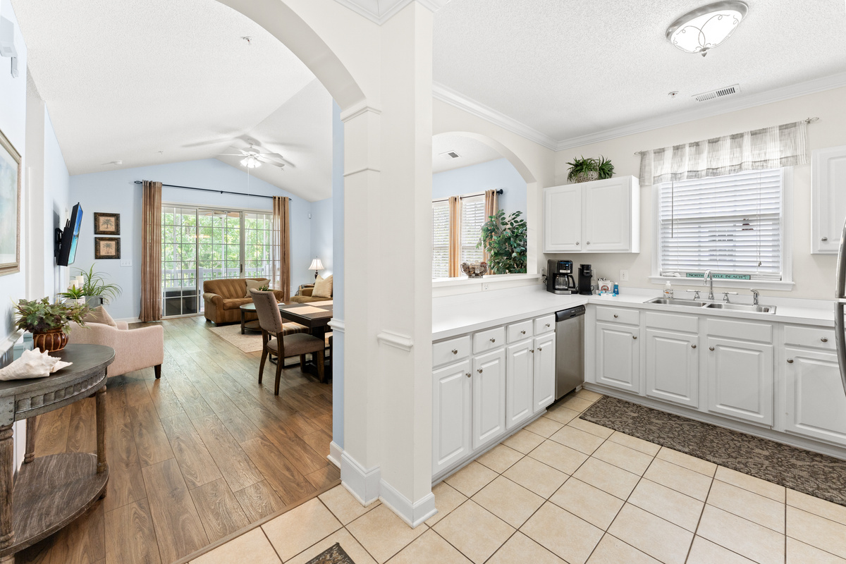 Open concept kitchen, dining, living room spaces