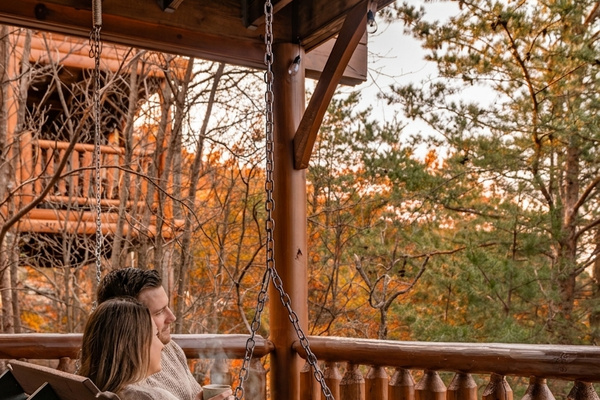 Leaf-peeping headquarters — porch swing with mountain views 🍂