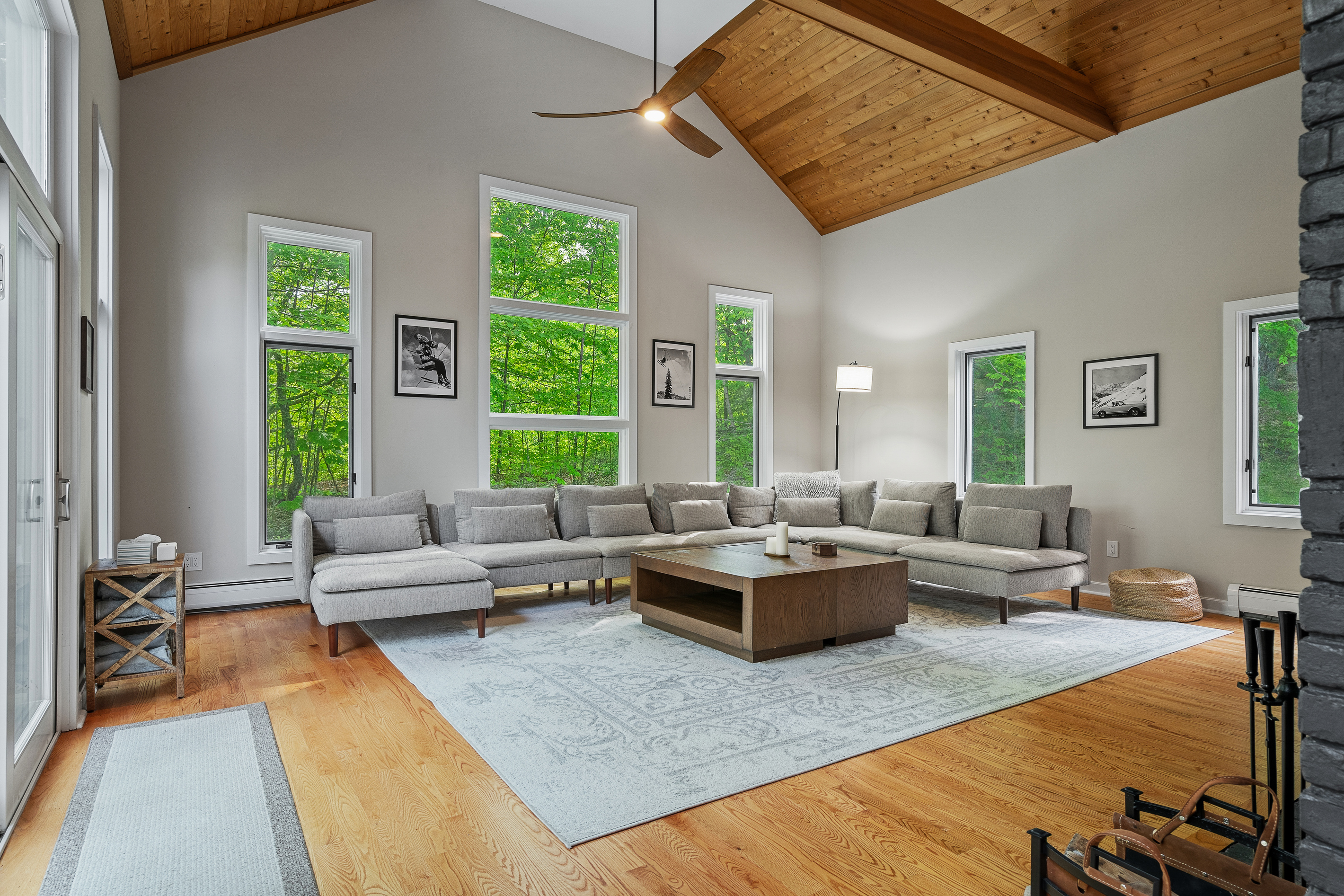 Great room with cathedral pine ceiling, sectional seating and forest views near Stratton Mountain