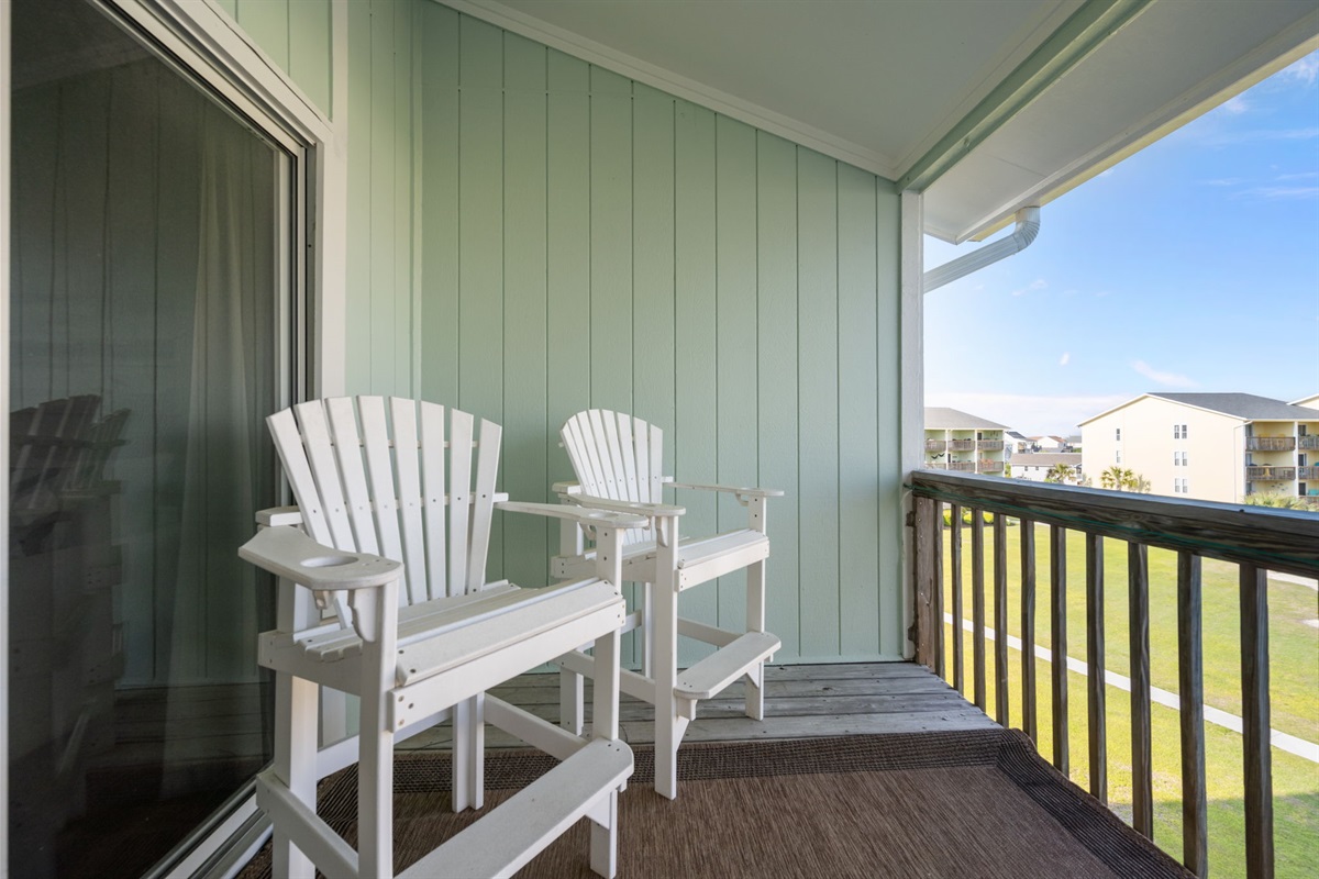 Private balcony with comfortable Adirondack seating&mdash;perfect for morning coffee or sunset unwinding
