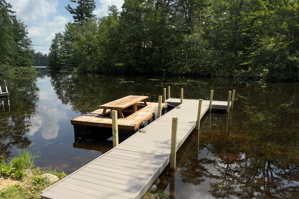 Lakefront Dock: Relax by the serene water in your private fishing spot with stunning views and a perfect picnic spot!