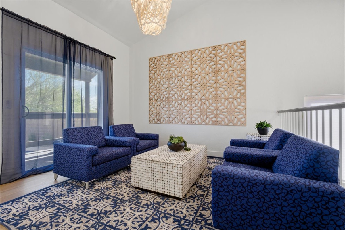 Just one of many gathering areas, this hip lounge connects to a deck and overlooks the game room.