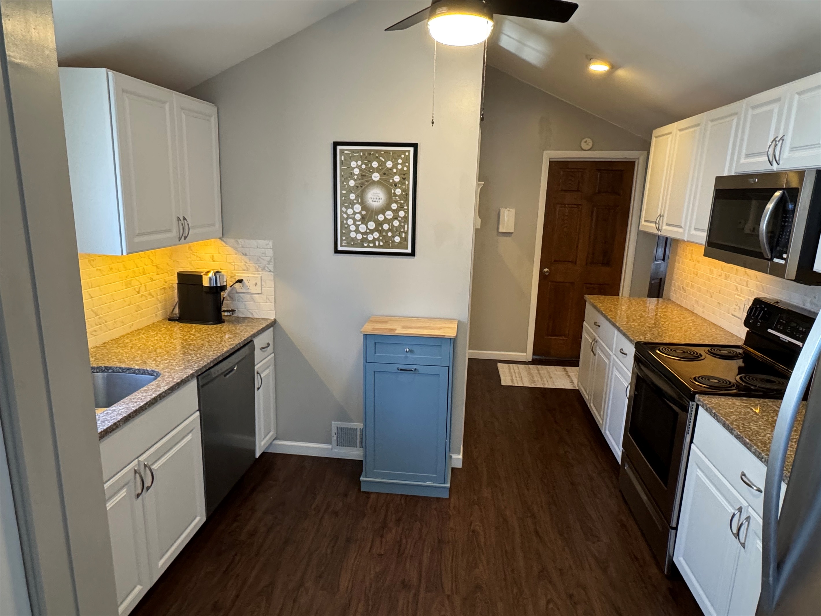 Kitchen: Dishwasher, electric stove, brand new Nespresso Vertuo, drip coffee maker, assortment of utensils and kitchen gadgets