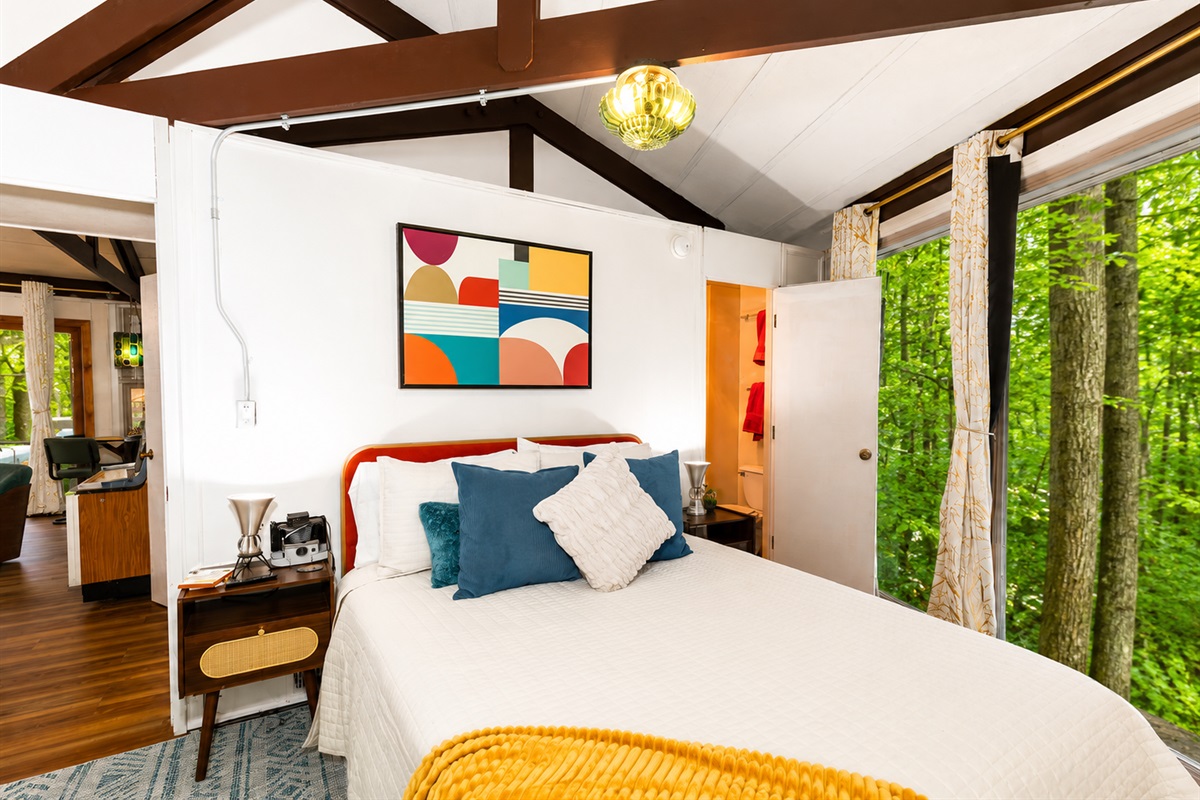 Bedroom with ensuite bathroom, wooded views. Queen Bed