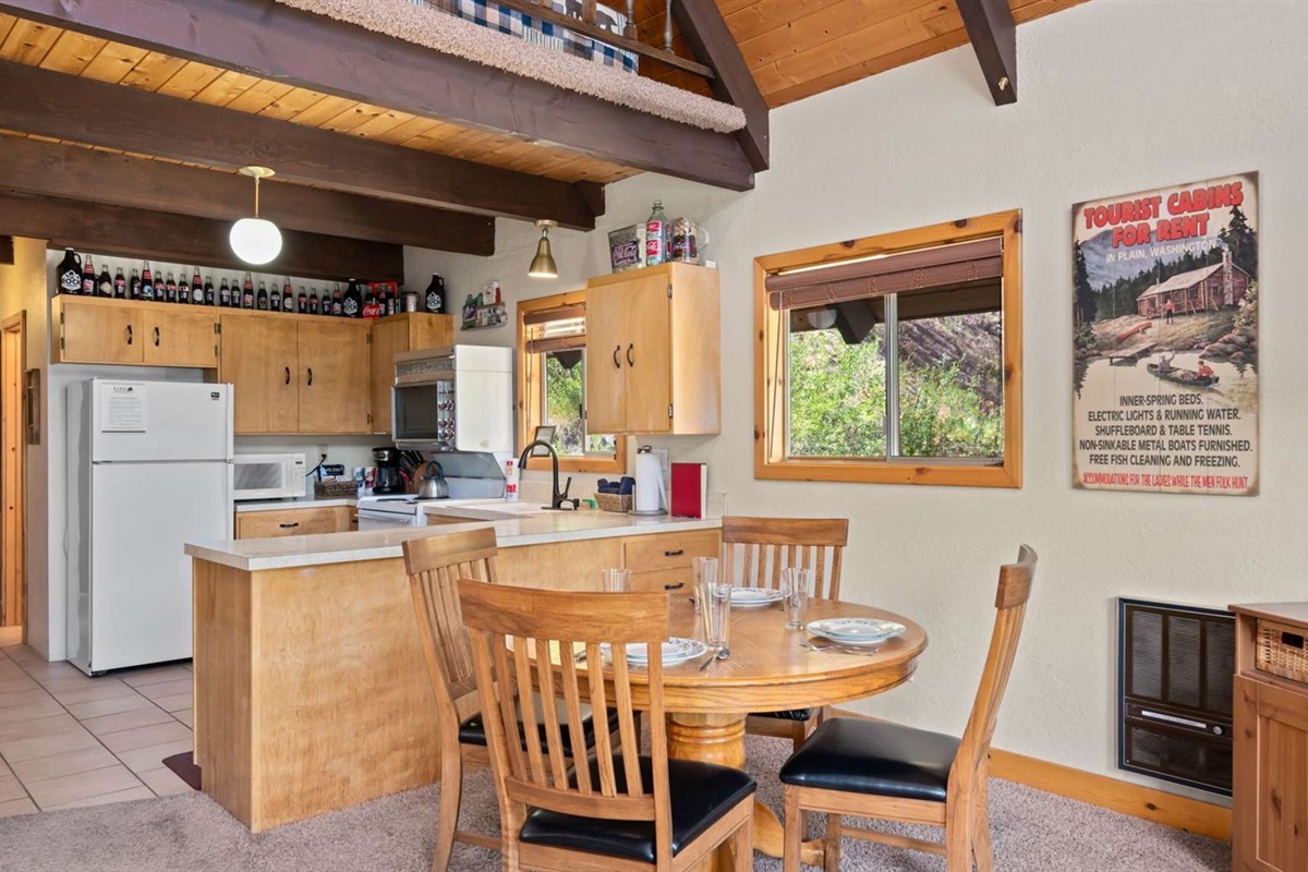 Dining area with mountain views and lots of natural light.
