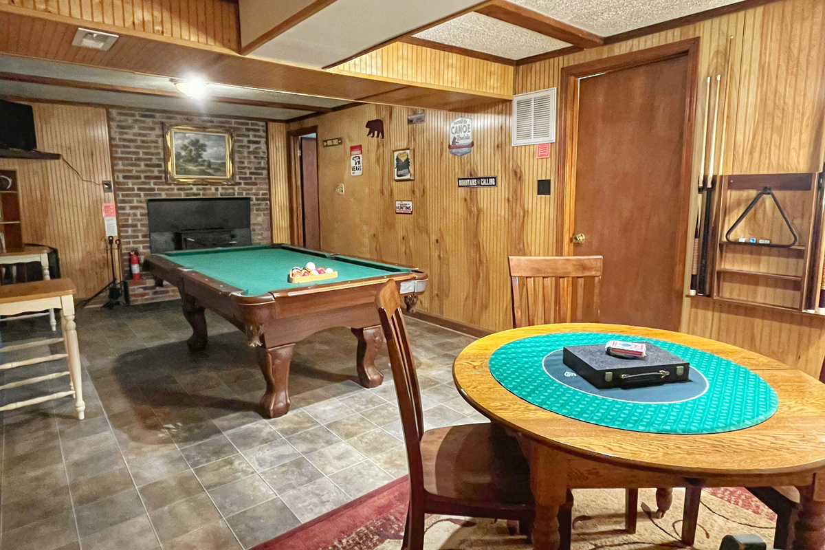 Relax downstairs with a game of pool or gather around the game table for cards, board games, or puzzles—the perfect spot to unwind after a day at the river.