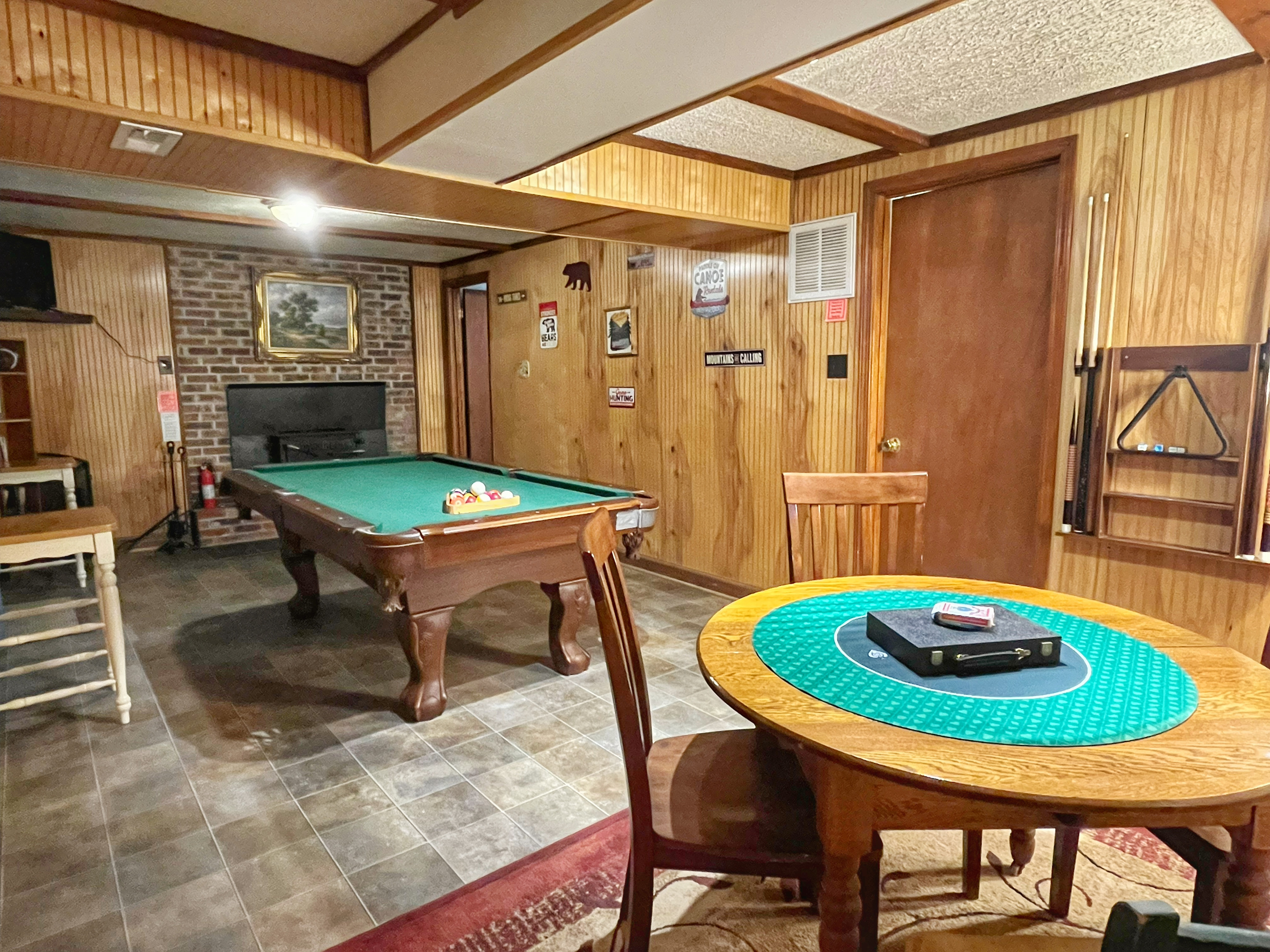 Relax downstairs with a game of pool or gather around the game table for cards, board games, or puzzles—the perfect spot to unwind after a day at the river.