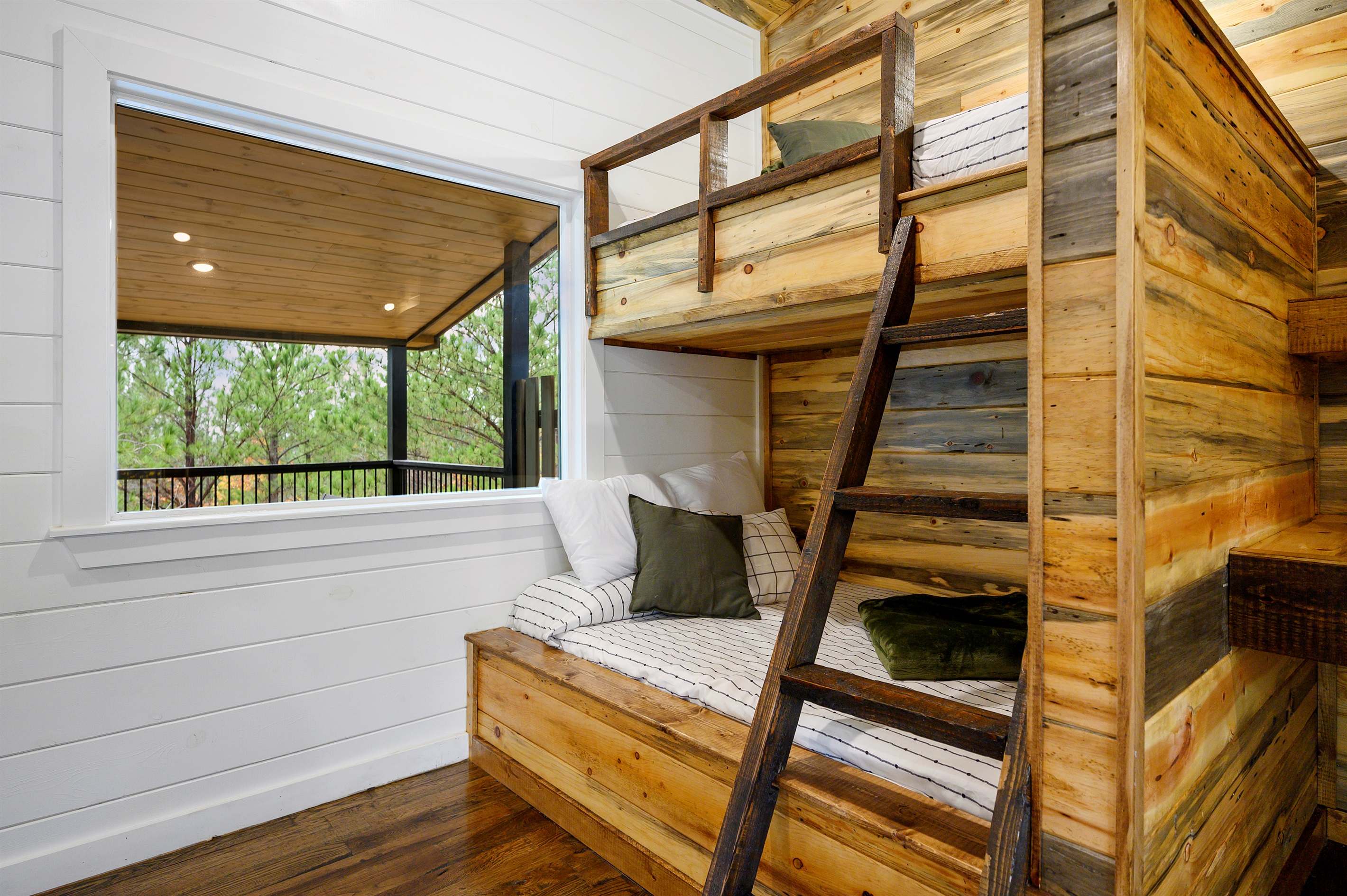 Built in bunks and cabin sleepover vibes done right. 
Perfect for kids, and late night storytelling after a full day of arcade battles and game room fun upstairs.