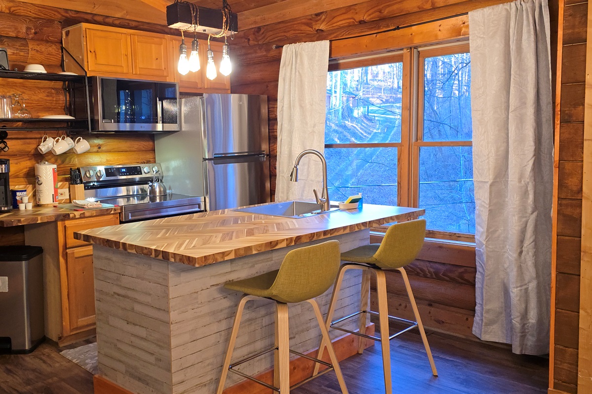 Gather around the kitchen island for snacks, stories, and connection in the heart of the cabin.