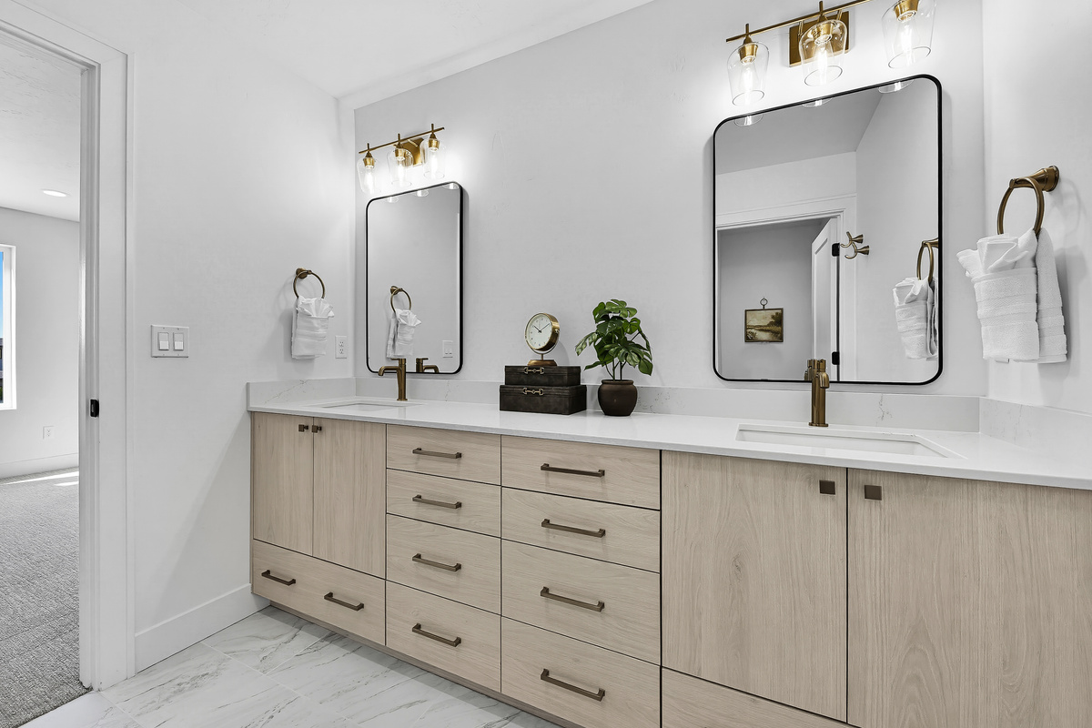 3rd floor bedroom with king size bed ensuite bathroom with shower and dual sink vanity