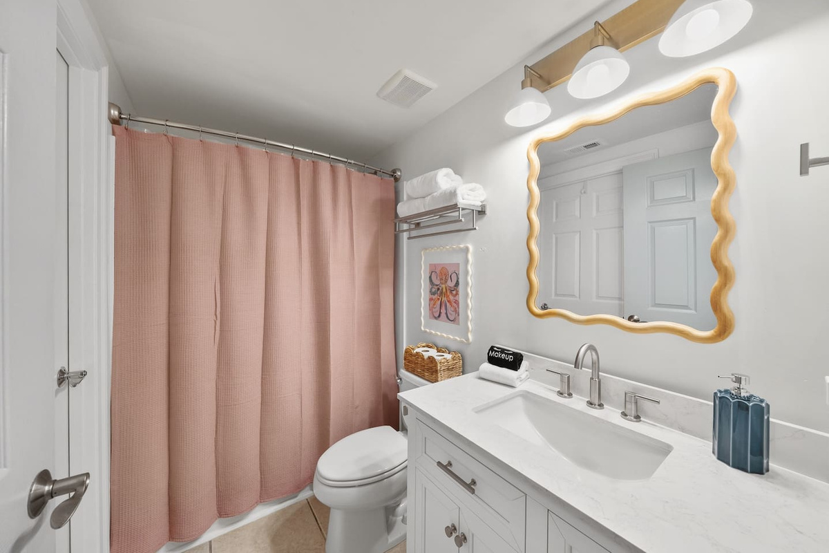 New shower/tub combo with plenty of shampoo, conditioner, and body wash.  Stool under the sink for little ones to be able to reach the sink.