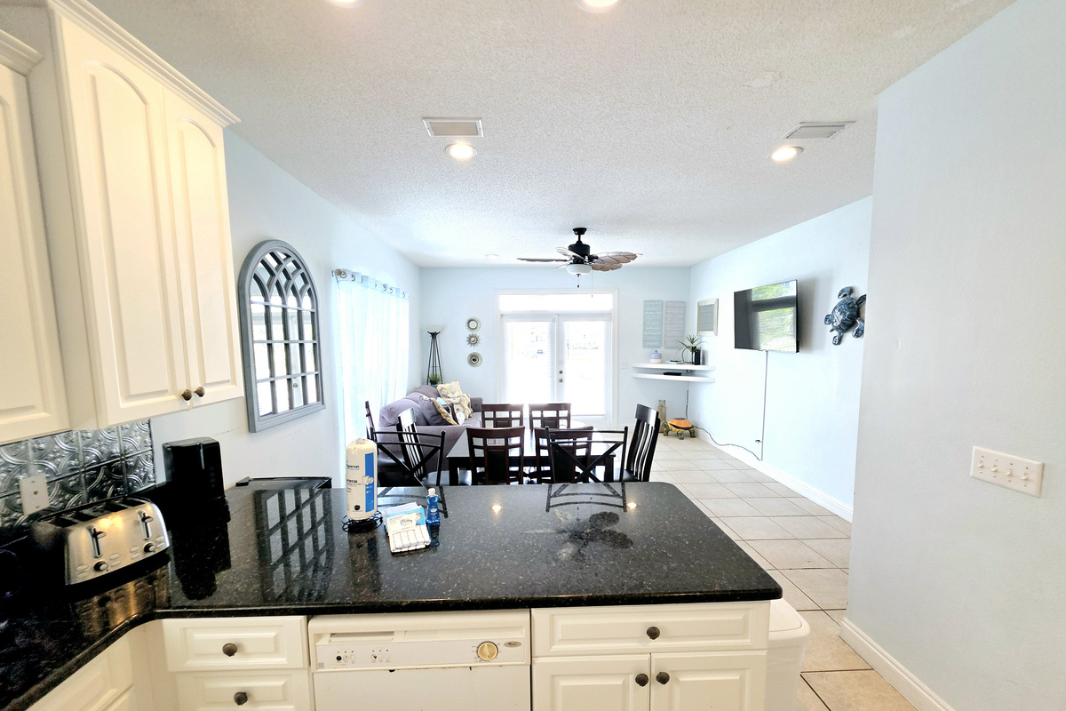 Dining table and living area with French doors