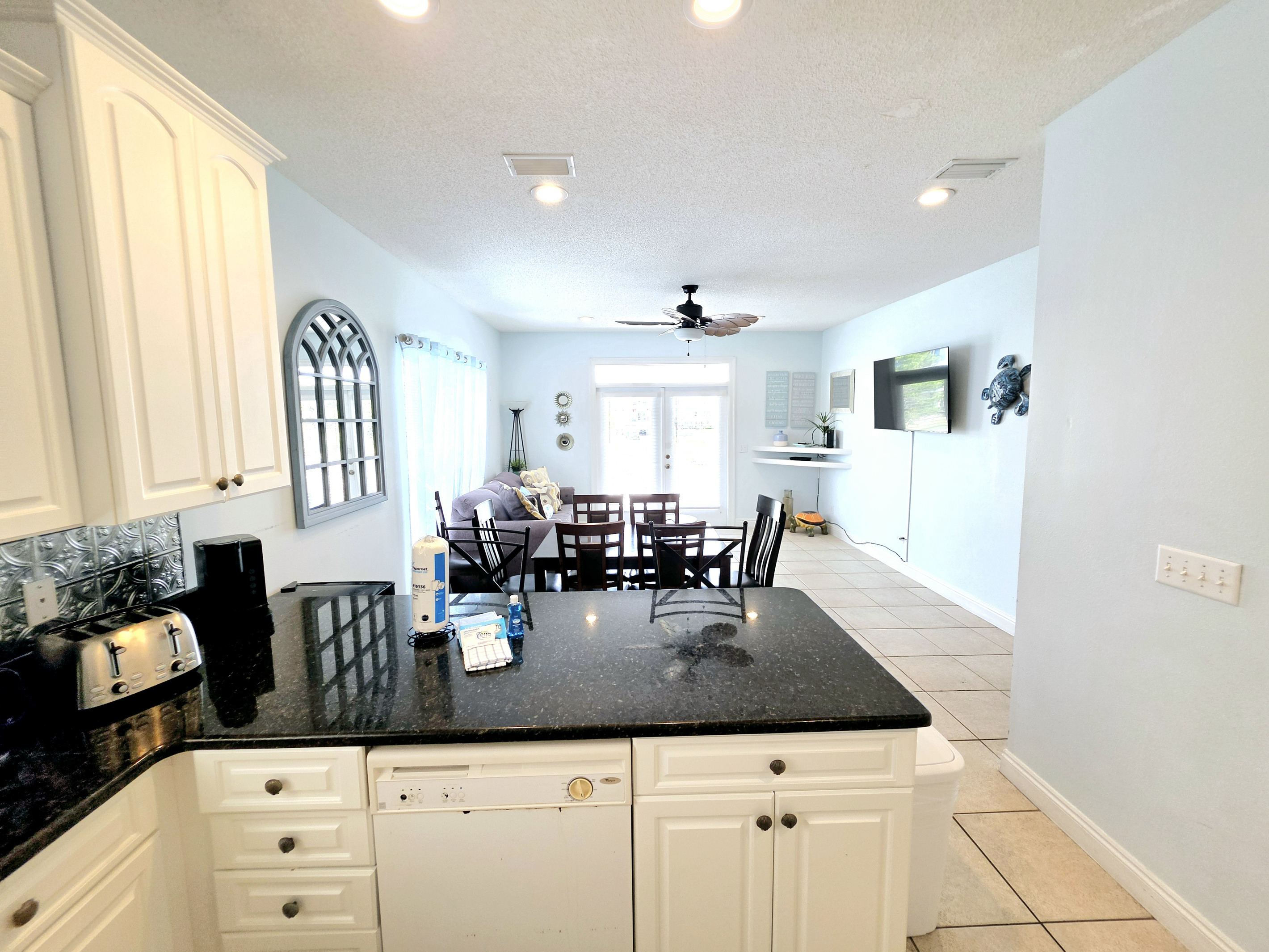 Dining table and living area with French doors