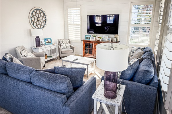 Spacious and inviting living room with generous seating, smart TV, and dedicated guest Netflix access.