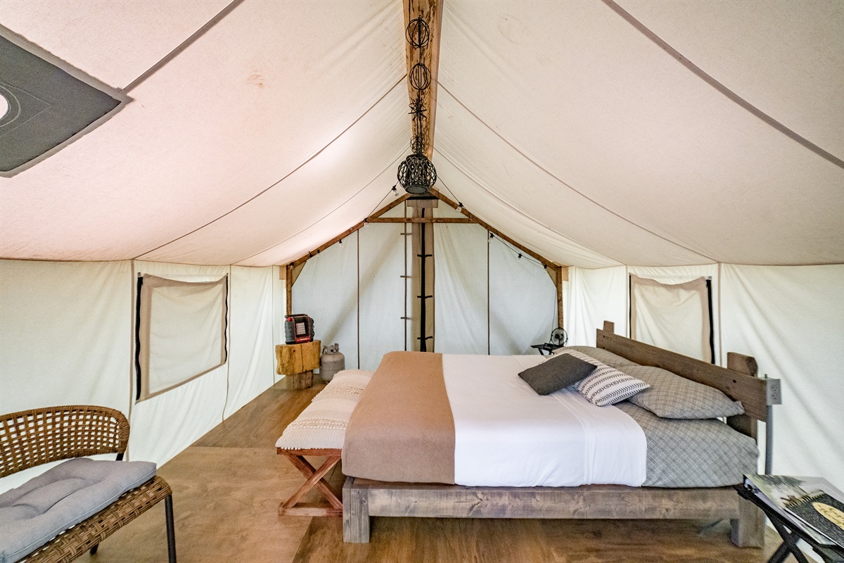 Wide angle view of bed inside of the tent