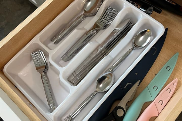 Fully equipped kitchen featuring sleek steel utensils and sharp knives, designed for efficient meal preparation. Combining style and functionality, this space is perfect for cooking and creating delicious meals with modern kitchen tools