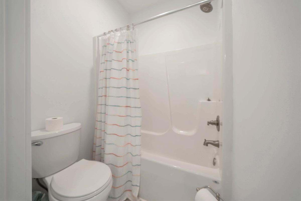 Enjoy a hot shower in the guest bathroom after a long day of exploring the town. The water pressure here is fantastic.