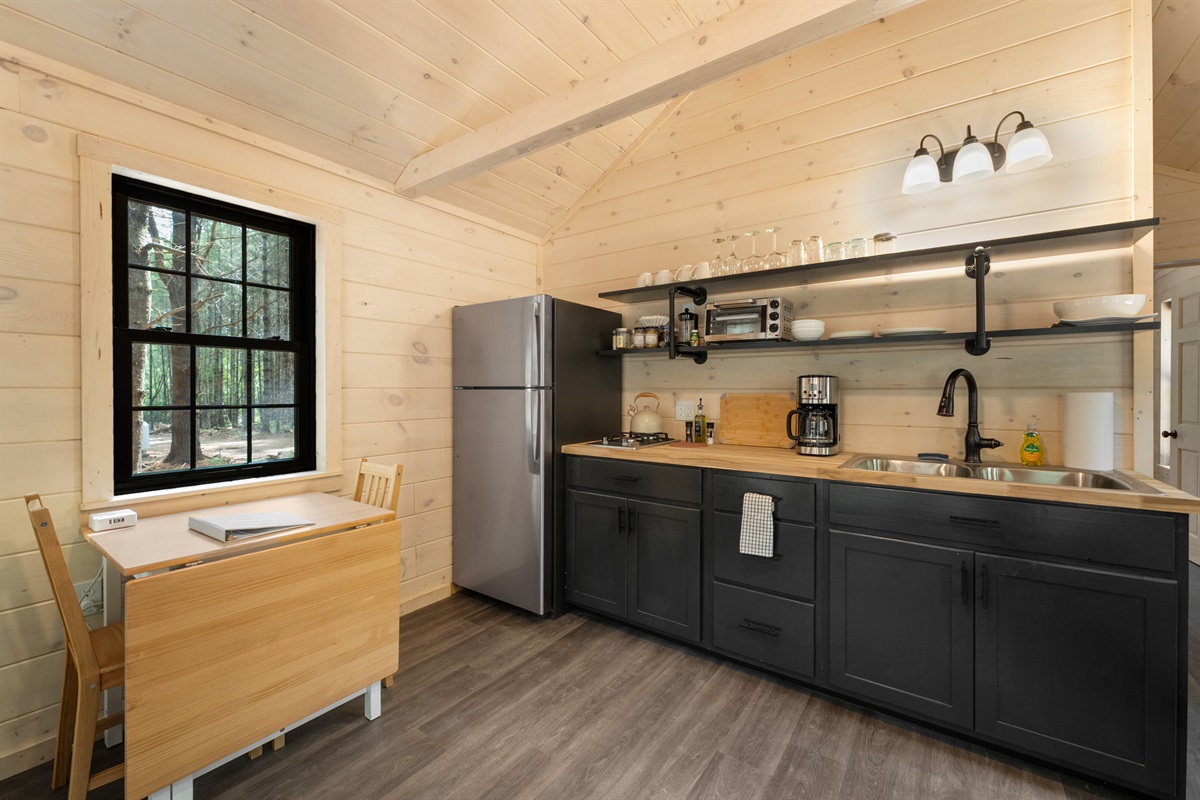 Fully stocked kitchen with dining area