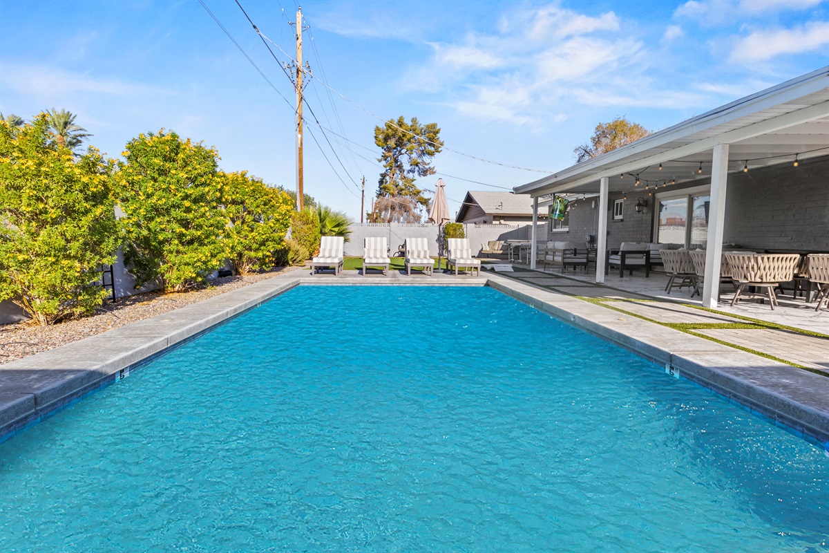 Private heated pool ringed by trees; dive in, then sunbathe on cushioned loungers under the endless blue.