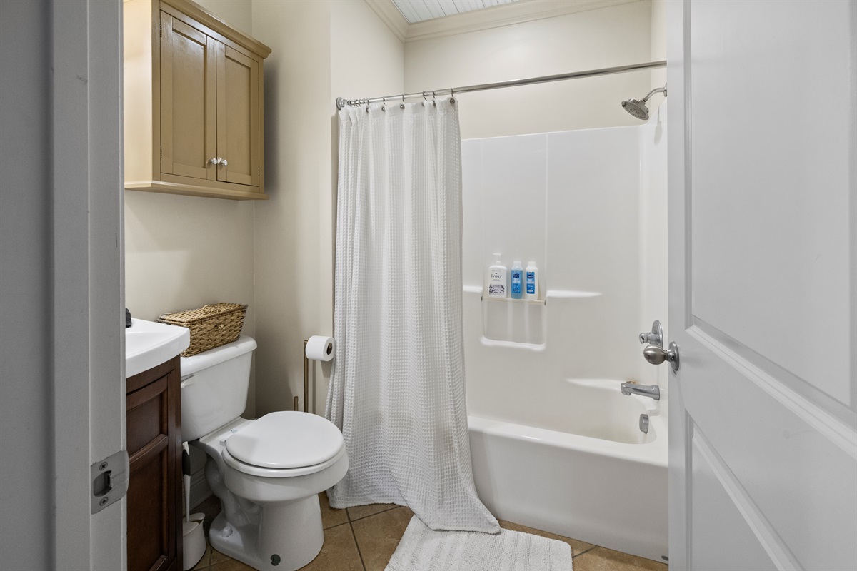 Full bathroom with tub and shower.