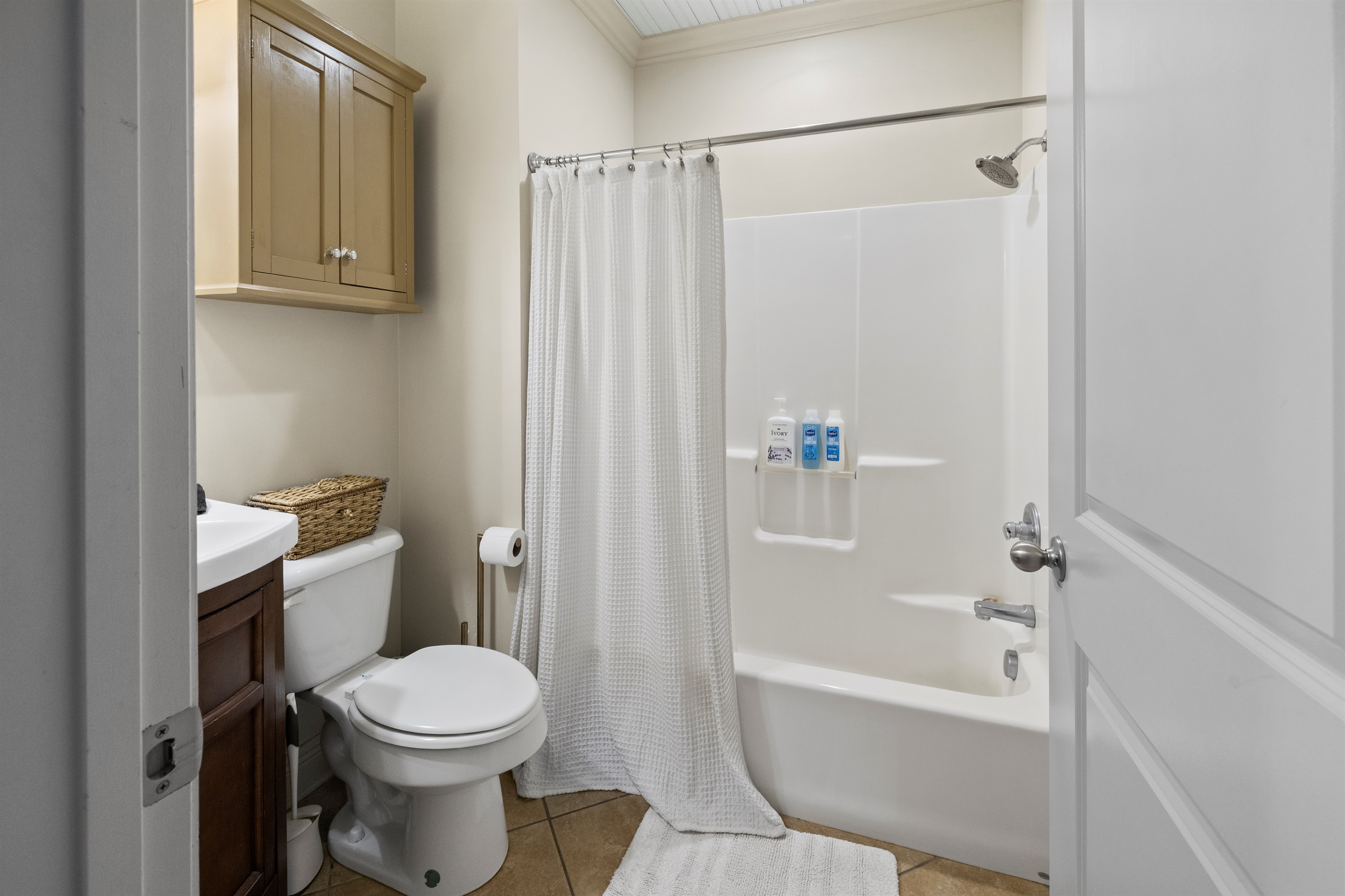Full bathroom with tub and shower.