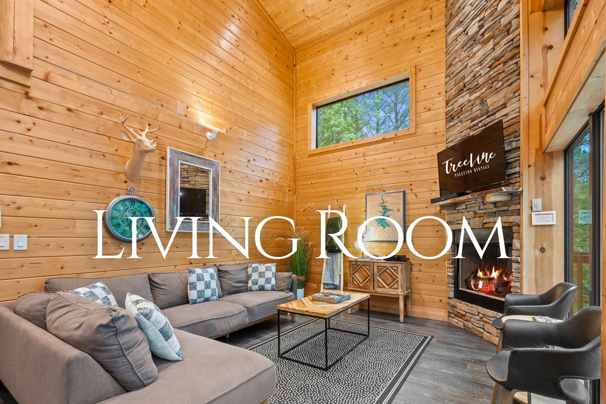 Walking into the living room, you&rsquo;re greeted by comfortable seating and warm wood finishes that instantly make the space feel welcoming.