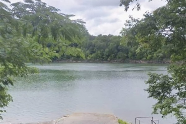 The neighborhood boat ramp features easy access for launching boats, plus metal stairs that lead down to the shoreline for fishing, wading, or enjoying the water up close.