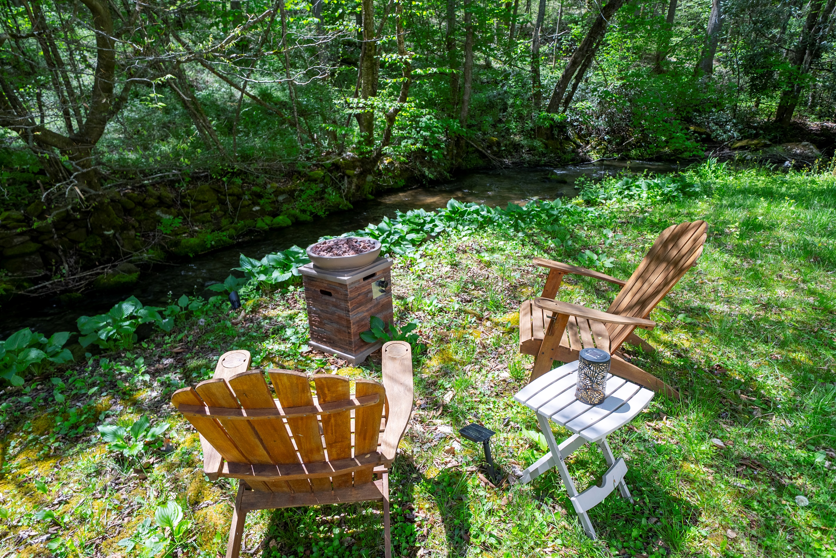 Relax by the propane fire pit while enjoying the sights and sounds of Yellow Creek.