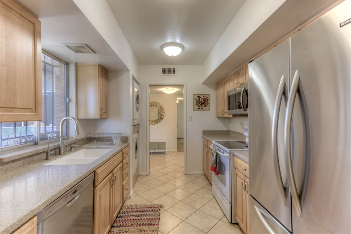 fully stocked kitchen including dishwasher, microwave and washing machine