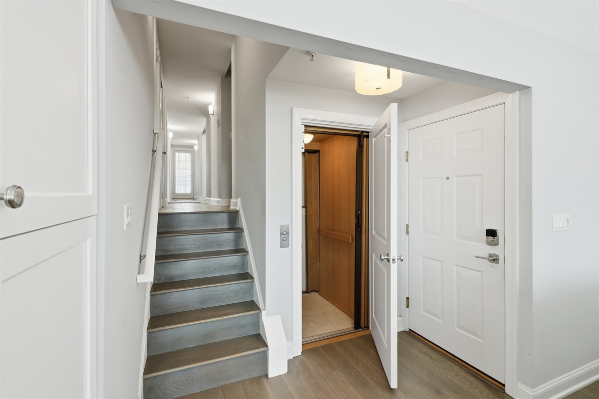Property access features a modern elevator and staircase