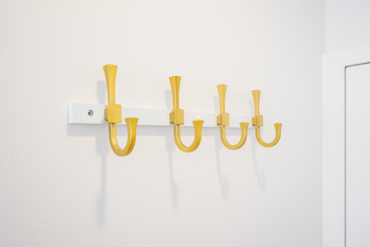 Hooks at entrance for your extra stuff on the go.