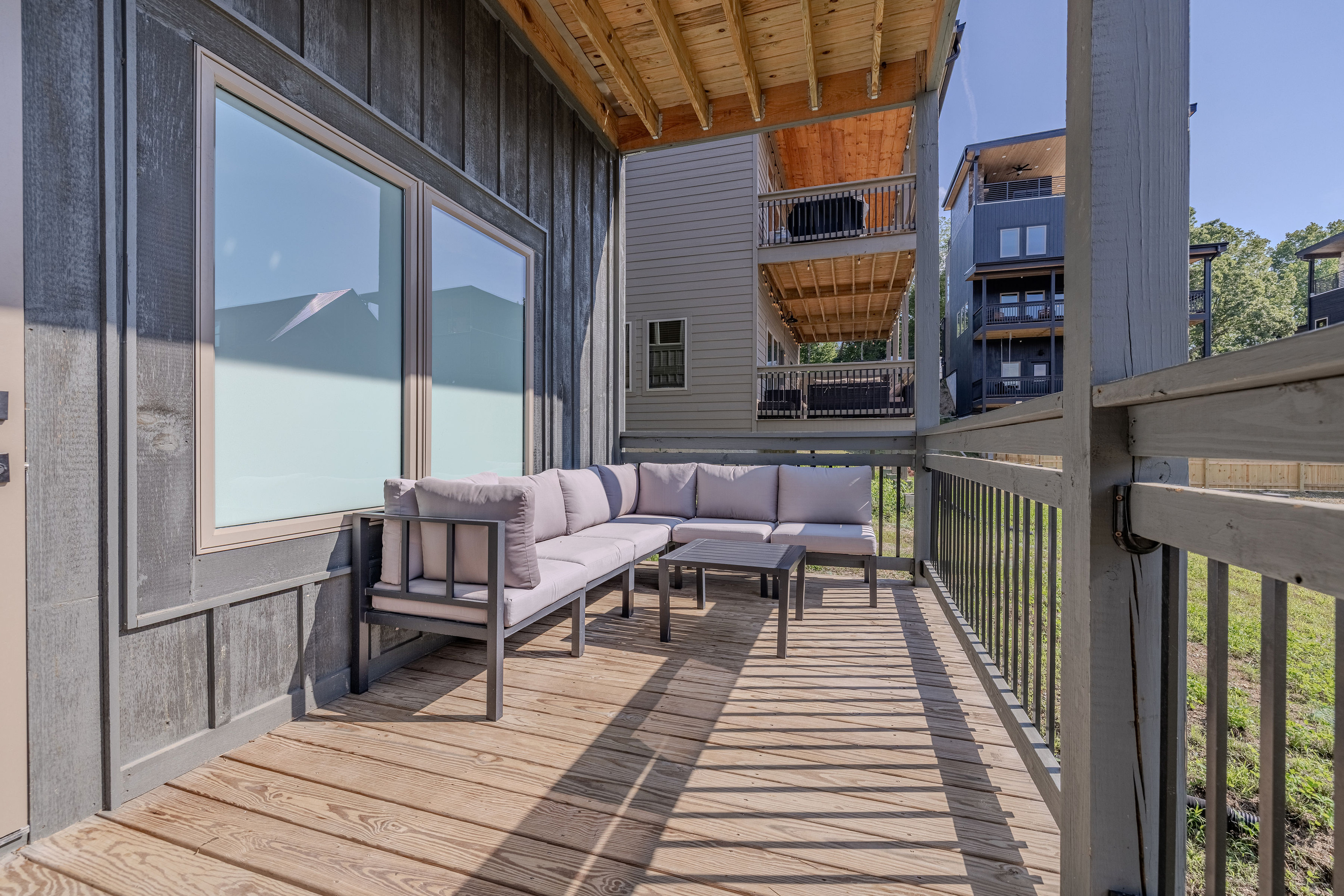 Covered deck access extends the living space outdoors.