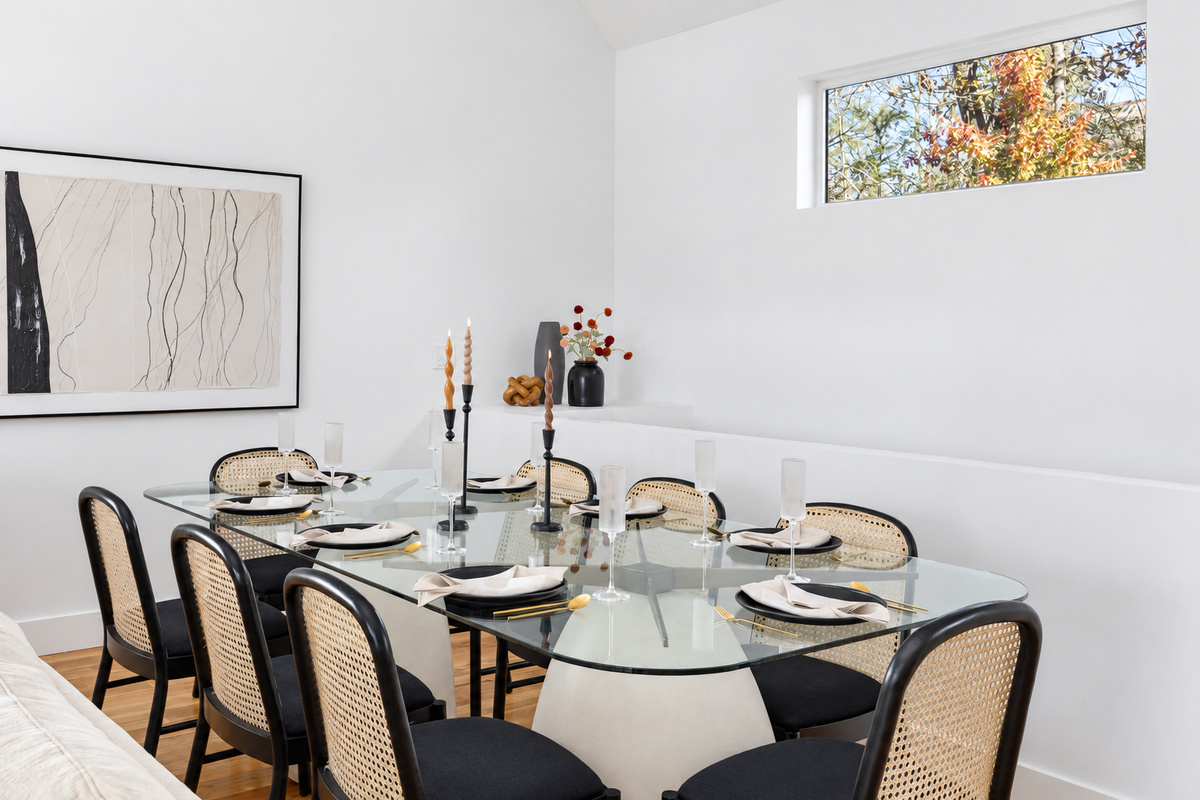 {Dining Room} A beautifully styled glass dining table with seating for your whole group—perfect for shared meals and celebrations.