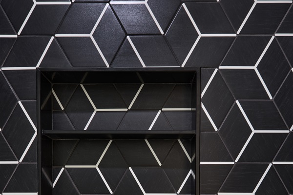 Modern elegance in every detail—geometric tile and luxury toiletries in the upstairs bath.