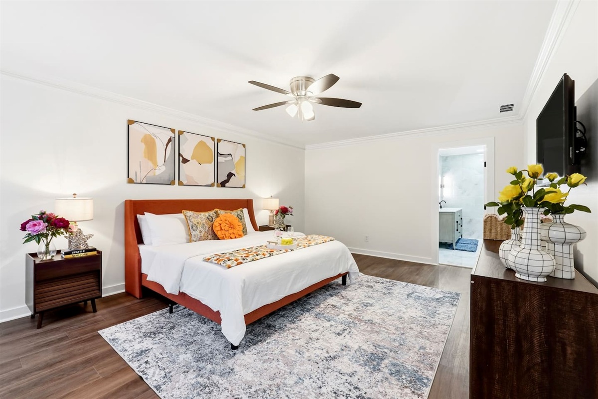 Beautiful second-level master bedroom featuring a king bed, a Roku-powered Smart TV, located all the way to the right at the top of the staircase. This room includes 2 full-body towels, 2 washcloths, and 2 hand towels for your stay.
