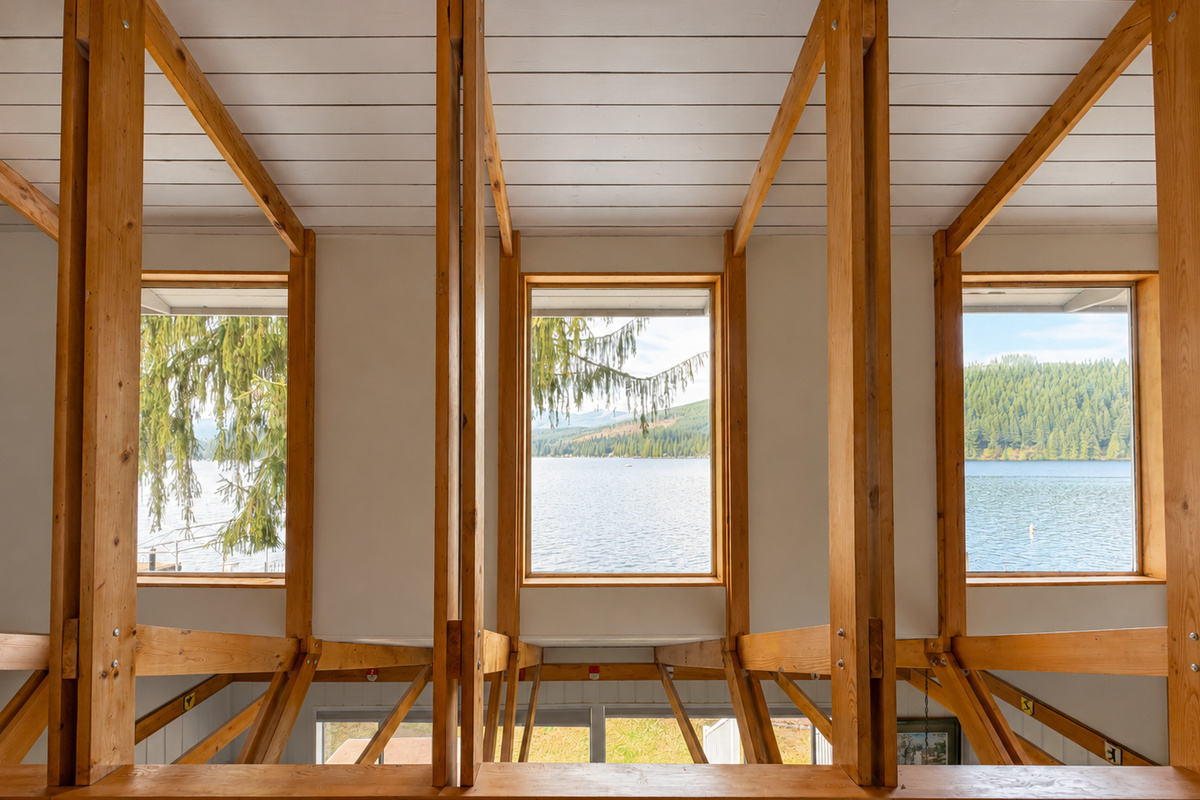 Bedroom 1 King. Wake up to beautiful lake and mountain views from the king bedroom, with a peaceful scene right outside your window.