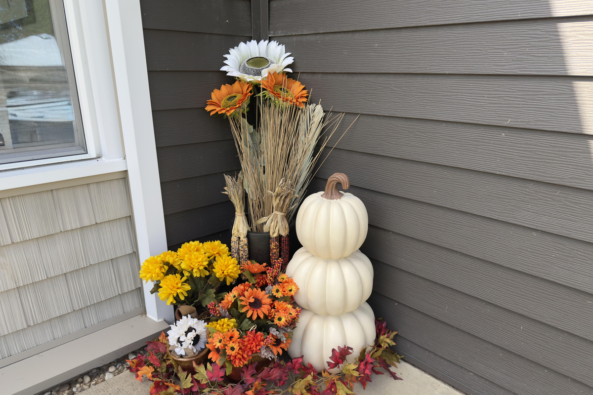 Welcoming front entrance dressed with seasonal fall accents.