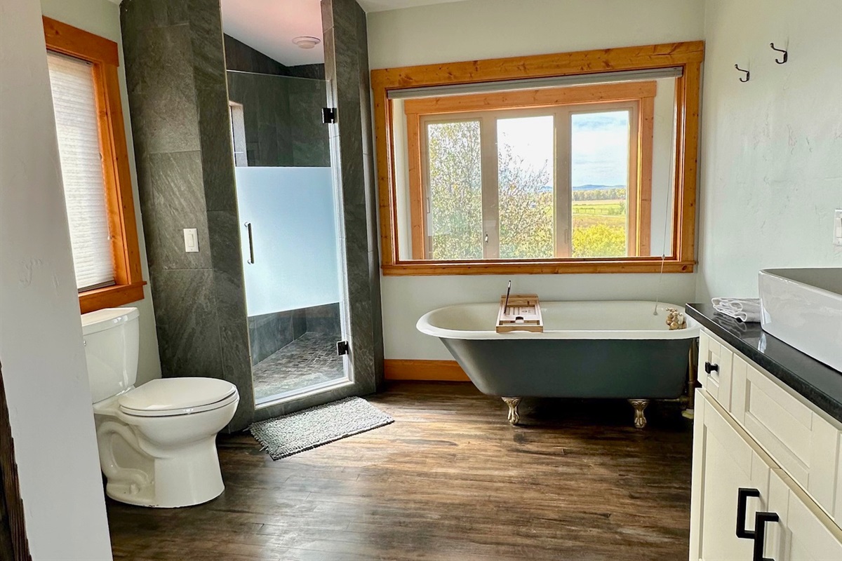 Unit A - Bathroom #2 has a walk-in shower, storage space, and upgraded fixtures.